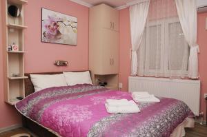 Postel nebo postele na pokoji v ubytování Favorit Apartments Čačak