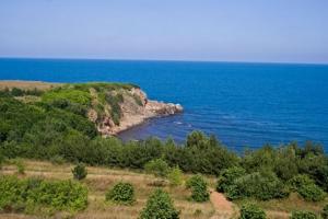 an island in the middle of a body of water at Apart Hotel Apolonia Palace in Sinemorets