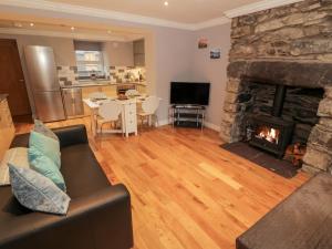 a living room with a couch and a fireplace at Annest in Bangor