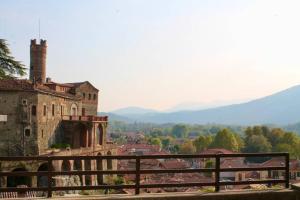 an old building with a view of a town at BORGHETTO STORICO - Fronte Castello in Villar Dora