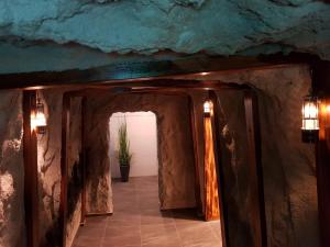 a hallway with a doorway into a room with a plant at Ruhr Inn Hotel in Hattingen