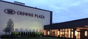 a building with a company sign on the side of it at Crowne Plaza Chicago-Northbrook, an IHG Hotel in Northbrook