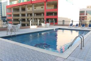 a swimming pool on the roof of a building at Pars International Hotel in Manama