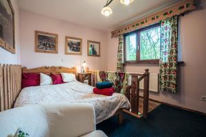 Posteľ alebo postele v izbe v ubytovaní Nasza Chata - Pokoje i Apartamenty