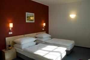 Posteľ alebo postele v izbe v ubytovaní Hotel Chvalská Tvrz