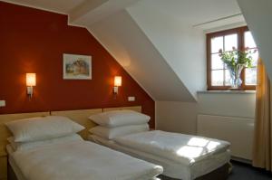 Posteľ alebo postele v izbe v ubytovaní Hotel Chvalská Tvrz