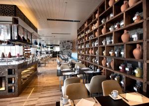 a restaurant with tables and chairs in a room at The Marmara Taksim in Istanbul