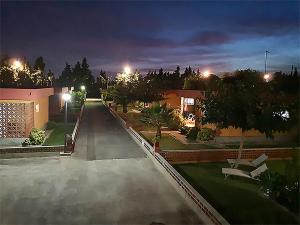 an empty parking lot at night with street lights at Bungalows Pascual in Vinarós