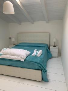 En eller flere senge i et værelse på Villa Bonanno Conti