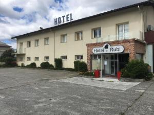 a hotel with a sign on the front of it at Hotel Rubi in Viseu