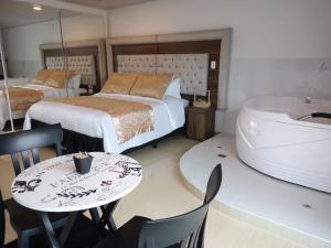 Postel nebo postele na pokoji v ubytování Hotel San Antonio Guarne