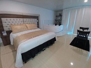 Postel nebo postele na pokoji v ubytování Hotel San Antonio Guarne
