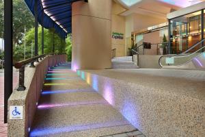 a building with purple lights on the side of it at Holiday Inn Express Kuala Lumpur City Centre, an IHG Hotel in Kuala Lumpur