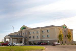 a hotel with cars parked in a parking lot at Holiday Inn Express Devils Lake, an IHG Hotel in Devils Lake