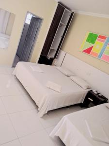 Postel nebo postele na pokoji v ubytování Hotel Capuchins