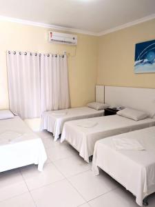 Postel nebo postele na pokoji v ubytování Hotel Capuchins