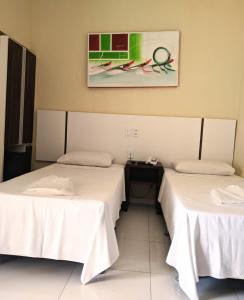 Postel nebo postele na pokoji v ubytování Hotel Capuchins