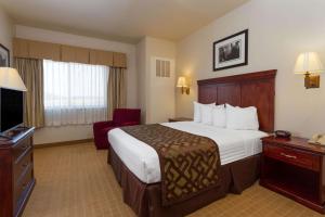 Кровать или кровати в номере Montcler Hotel & Conference Center, Trademark by Wyndham