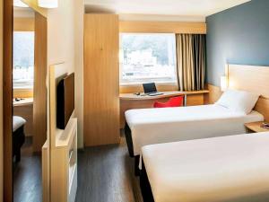 Postel nebo postele na pokoji v ubytování ibis Copacabana Posto 5