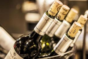 a bunch of bottles of wine in a basket at Estero Inn in Morro Bay