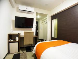 Un pat sau paturi într-o cameră la High Set HOTEL SHIZUOKA Inter