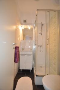 a bathroom with a shower and a sink at Downtown Main Street Studio in Zadar +61 photos