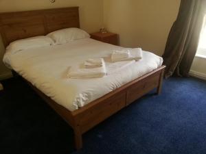 Łóżko lub łóżka w pokoju w obiekcie Exchequergate