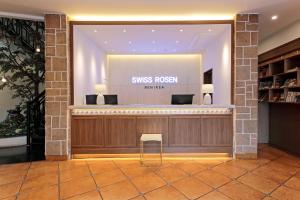 a lobby with a sign that reads siniss revision feature at Benikea Swiss Rosen Hotel in Gyeongju