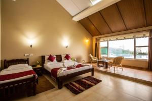 Postel nebo postele na pokoji v ubytování KSTDC Hotel Mayura Valley View Madikeri