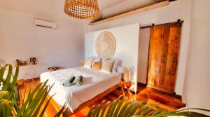 Ein Bett oder Betten in einem Zimmer der Unterkunft Mangata Boutique Bungalows