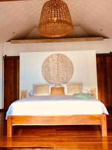 Ein Bett oder Betten in einem Zimmer der Unterkunft Mangata Boutique Bungalows
