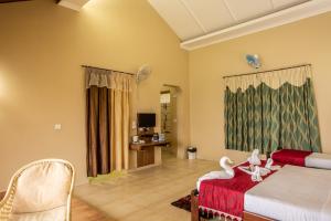 Postel nebo postele na pokoji v ubytování KSTDC Hotel Mayura Valley View Madikeri
