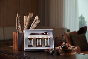 a gift box with three bottles of essential oils on a table at PARK ROCHE Resort & Wellness in Jeongseon