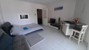 Televízia a/alebo spoločenská miestnosť v ubytovaní Onix -Orfű Aqua Apartman
