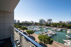 a view of a marina with boats in the water at Hotel Mare in Lignano Sabbiadoro