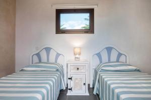 A bed or beds in a room at Villa La Era 1
