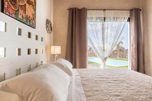 A bed or beds in a room at Villa La Era 1