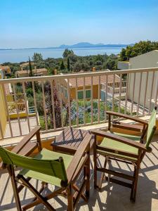 a pair of chairs and a table on a balcony at La Riviera Barbati Seaside Apartments & villas in Barbati
