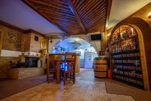 a room with a bar and a wine tasting room at Pensiunea Sura Dacilor - Alex in Poiana Brasov