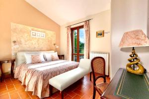 Un pat sau paturi într-o cameră la Resort Umbria Spa
