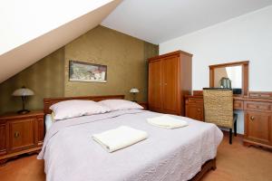 Postel nebo postele na pokoji v ubytování Willa Studio + 37 fotografií