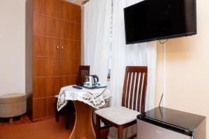 TV a/nebo společenská místnost v ubytování Willa Studio