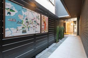 a hallway with a mural on the side of a building at GRAND BASE Kagoshima Tenmonkan in Kagoshima