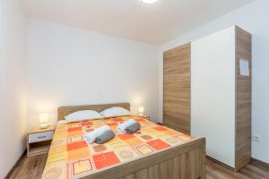 Łóżko lub łóżka w pokoju w obiekcie Holiday house TRANQUILLITY