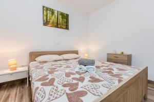 Łóżko lub łóżka w pokoju w obiekcie Holiday house TRANQUILLITY