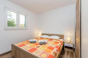 Łóżko lub łóżka w pokoju w obiekcie Holiday house TRANQUILLITY
