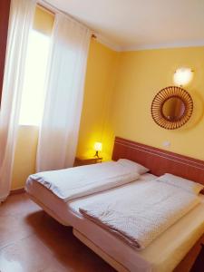 En eller flere senge i et værelse på Casa Atlantica