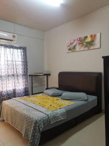 Ένα ή περισσότερα κρεβάτια σε δωμάτιο στο Marina@terryHOMES +36 φωτογραφίες