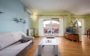 Televízia a/alebo spoločenská miestnosť v ubytovaní IVA house with apartment