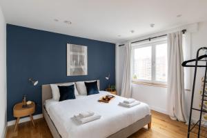 Voodi või voodid majutusasutuse homely – Central London Luxury Apartments Camden toas